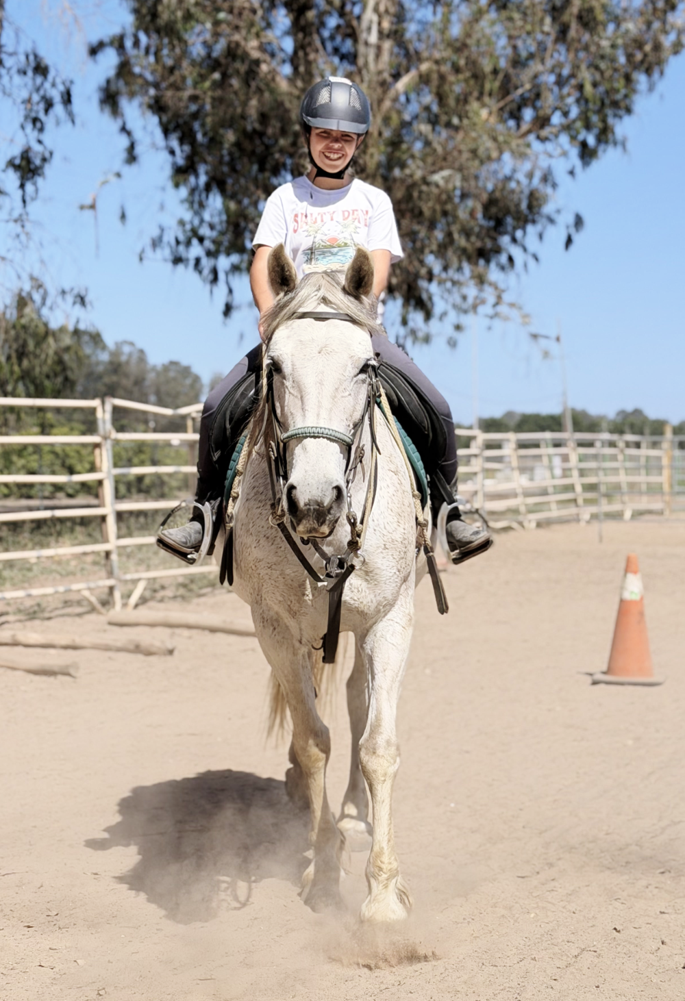 Young rider with a forward-facing Mustang at United Mustangs of America